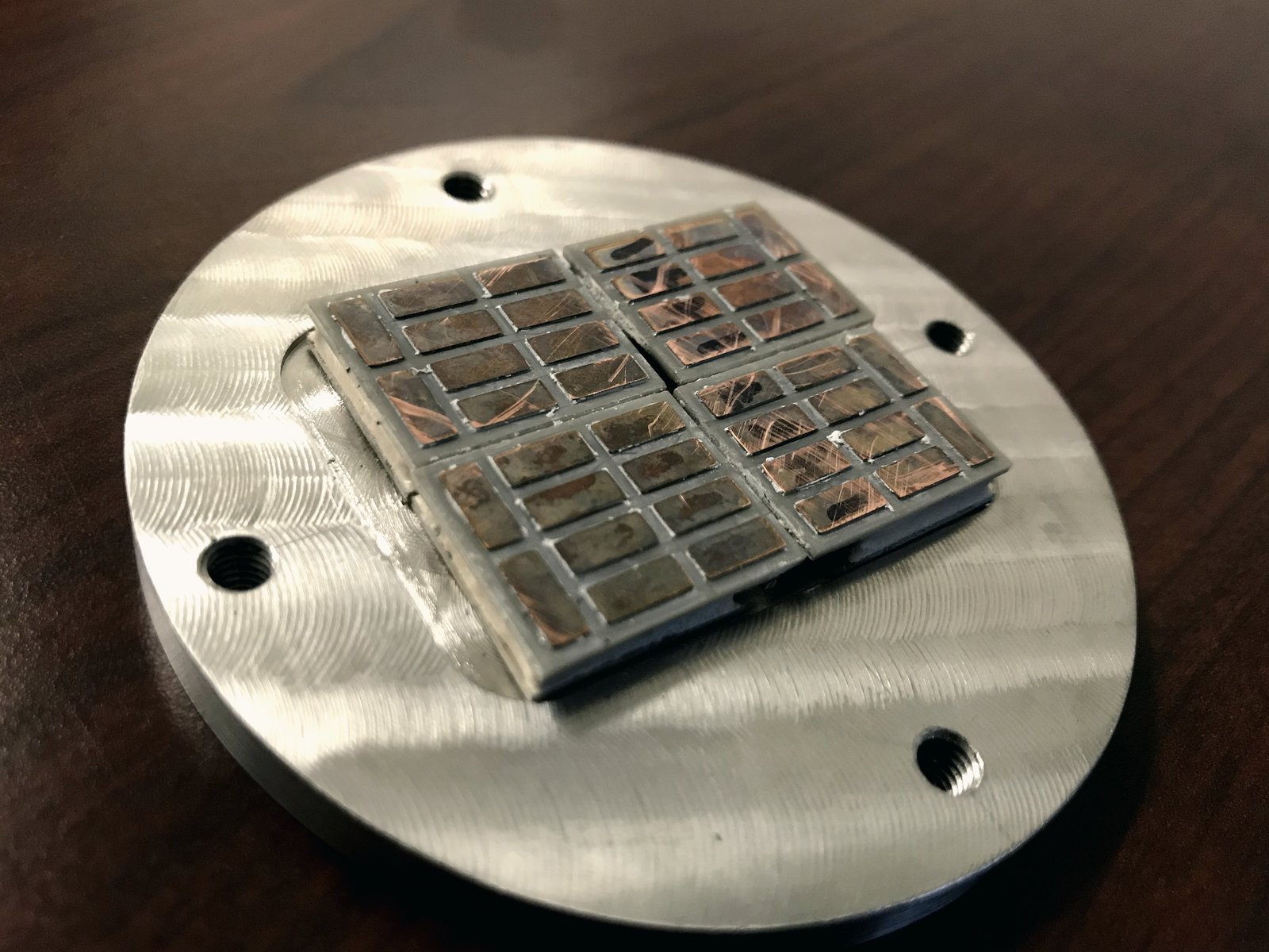 Four-module TEG assembly with copper interconnect on a machined aluminum mounting plate